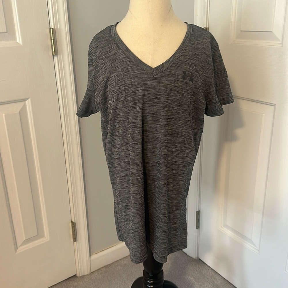This is a heather gray athletic Under Armor tee shirt in a size medium.